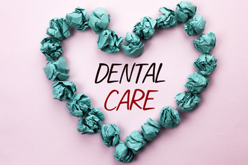 Conceptual hand writing showing Dental Care. Business photo text Oral Tooth Mouth Caring Safety Hygiene Protection Regulations written on Plain background within Heart Paper Balls.