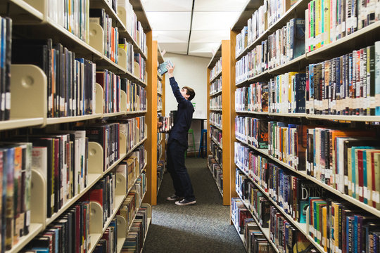 Teen Boy in Library