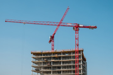 new building under concstruction - cranes and building shell
