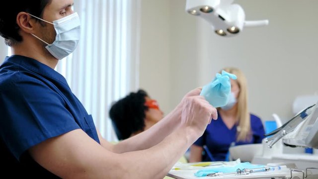 Dentist and his assitant working in private practice.