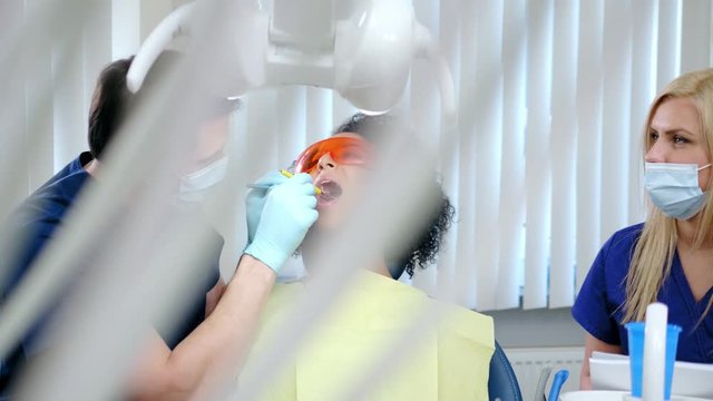 Dentist and his assitant working in private practice.