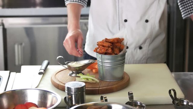 Fried chicken wings, chef. Meat appetizer and sauce.