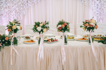 Elegant table arrangement and catering at wedding reception stylish bouquet centerpiece