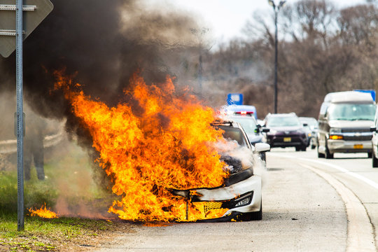 Burning Car On Fire On A Highway Road Accident