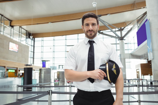 Pilot standing in airport terminal