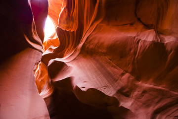 Twisty fiery curves of the Lower Canyon Antelope in Arizona illuminated by the meager rays of light...
