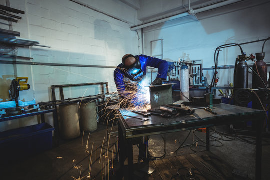 Male welder working on a piece of metal