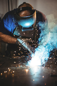 Welder welding a metal