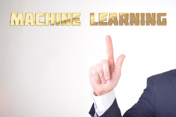 A businessman shows an inscription:MACHINE LEARNING