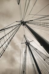 Fototapeta premium Old boat masts against stormy sky