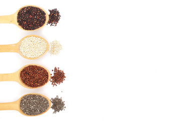 Black red white quinoa and chia seeds in wooden spoon isolated on white background with copy space for your text