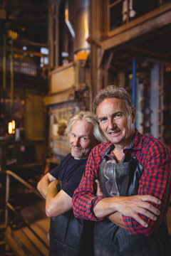 Portrait of glassblowers with arms crossed
