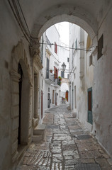 Fototapeta premium Ostuni (Puglia, Italy) - The gorgeous white city in province of Brindisi, Apulia region, Southern Italy, with the old historic center on the hill and beside the sea