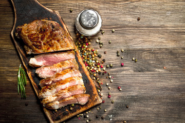 Beef grill with spices on a cutting Board.