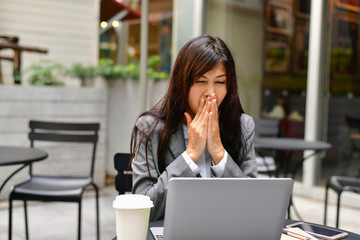 Business Concept.Young Asian businesswoman is working happily.Young businesswoman working in a cafe.Young businesswoman is relaxation in a coffee shop.