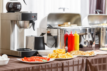Buffet heated trays ready for service. Breakfast in hotel smorgasbord.