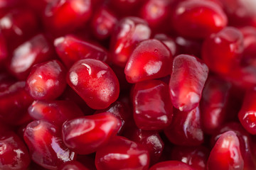 Close up of fresh organic pomegranate seeds, fruit