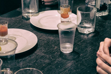 Glasses standing on table while drinking