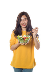 Portrait of  beautiful asian young  woman eating vegetable salad Isolated on white background.