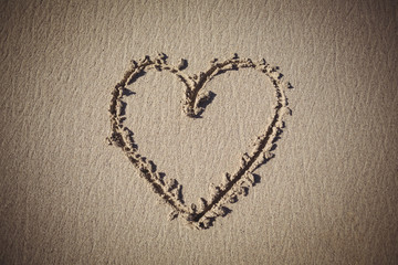 Heart drawn on sand