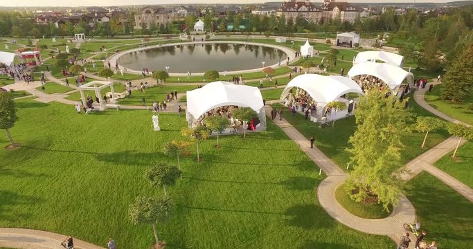 Aerial view over beautiful cottages. Small green village from above, top view of Houses in a neighborhood area. Countryside, real estate and private property concept.