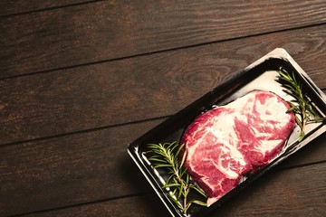 Raw steak in an airtight packaging