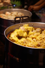Chiang Mai, Thailand - April 8, 2018 : Street food (Pork Dumpling with steam) at the Sunday Night Market Walking Street on April 8, 2018 in Chiang Mai, Thailand. Selective focus.
