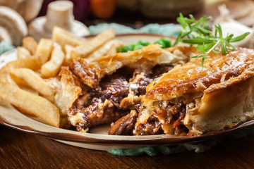 Homemade beef stew pie with french fries
