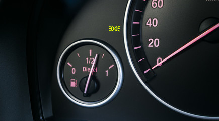 Car instrument panel. Dashboard closeup with visible speedometer and fuel level. Modern car...