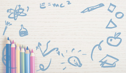 Crayons on white plank