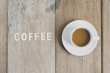 a cup of coffee put on wood table background