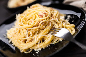 Spaghetti carbonara with egg and pancetta
