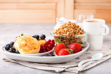 Cottage cheese pancakes with berries. Selective focus. Russian cheesecakes. Copy space