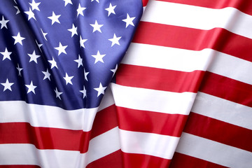 Fototapeta premium Close up of ruffled American flag. Patriots day, memorial weekend, veterans day, presidents day, independence day background. United States of America national stars and stripes symbol. Copy space.