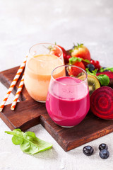 Vegetable juice from carrots and beet in glasses on a table