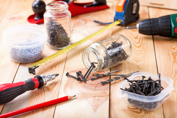 Tools and screws on a table. Selective focus. Copy space