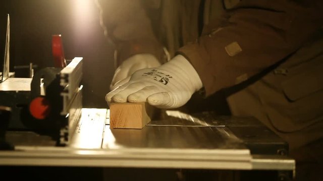 hand gouging the wooden board on machine