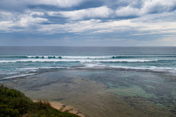 Moody rain clouds over the ocean near Portsea in Victoria, Australia