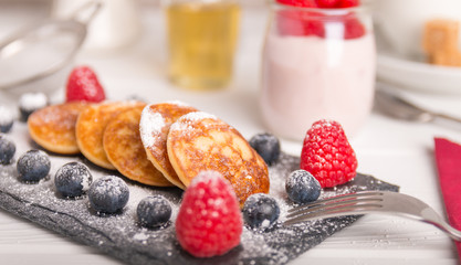 mini pancakes with fruit and honey