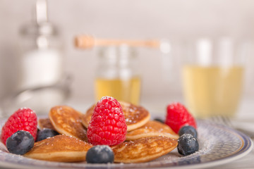 mini pancakes with fruit and honey