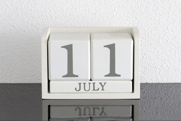 White block calendar present date 11 and month July