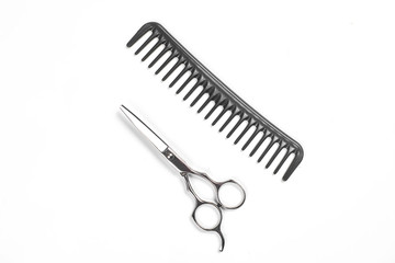 Professional hairdresser tools on white background with copy space