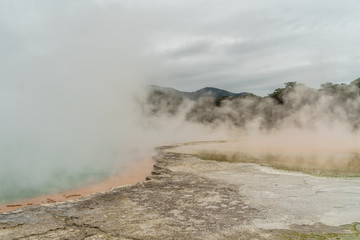 dramatic shot of steaming hot spring on cloudy day, New Zealand