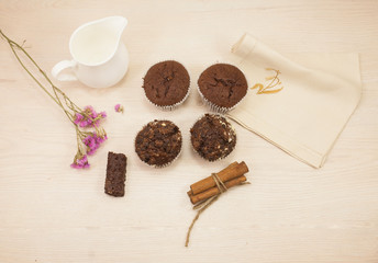 Chocolate muffins on a white table 