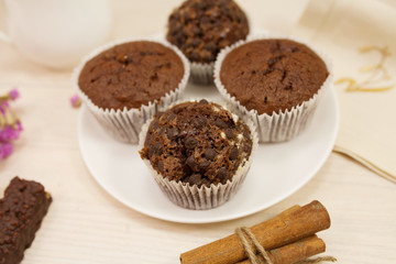 Chocolate muffin on white background. Kitchen table