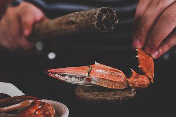 wooden mash crab used to beat cooked crabs for easy eating
