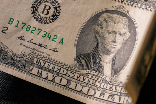 The front of a two dollar bill,