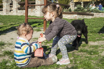 Brother and sister playing at the countryside