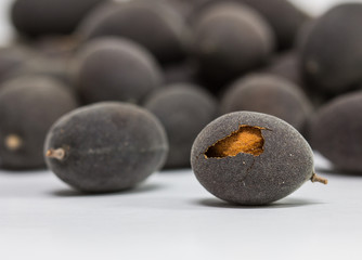 Tamarind velvet or Dialium cochinchinense Thai native fruit, Shot in the studio  on a white background.