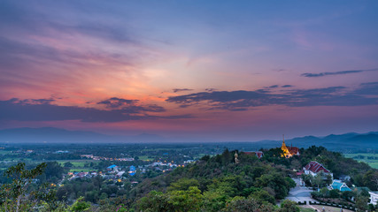 Wat Phrathat Doi Saket with colorful sunset sky and clouds. Chiang Mai, Thailand.